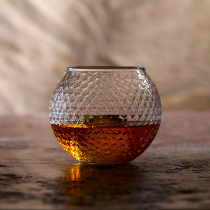 Golf themed whiskey glass with realistic golf ball texture