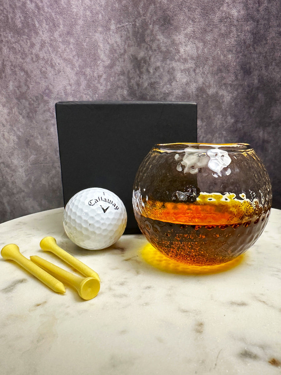 Golf ball shape whiskey glass gift set in a black luxury box, perfect for gifting to golf lovers and whiskey aficionados