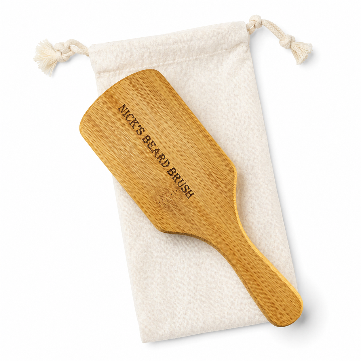 Personalized beard brush for men with engraved bamboo handle and natural boar bristles for beard grooming and styling.