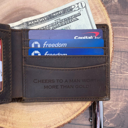 Open wallet with money and cards on a wooden surface